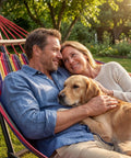 Couple with dog relaxing in Double Hammock With Heavy Duty Steel Stand Portable Easy Assembly 600Lb Weight Capacity Adjustable Hooks Cotton Comfort Durable Frame Carrying Bag Included Ideal For Indoor Yard Camping And Outdoor Rainbow