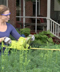 Person using Multi Angle Telescoping Electric Hedge Trimmer With Convertible Pole To Handheld 19 Inch Blade 4.5 Amp outdoors