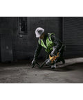 Worker using Beast 20V Cordless Handheld Vacuum With HEPA Filter LED Light for dry debris on workshop floor