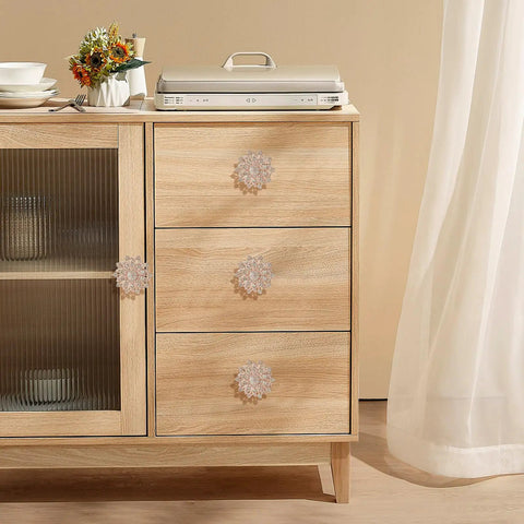 Four Piece Flower Shape Cabinet Knob Set In Rose Gold With Crystal Glass Pull Handles installed on wooden cabinet drawers.
