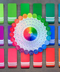 Color Card Deck For Creators Break Free From The Color Wheel With 200 Coordinated Cards displayed on a table in multiple colors