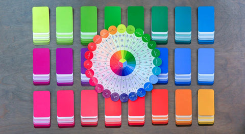 Color Card Deck For Creators Break Free From The Color Wheel With 200 Coordinated Cards displayed on a table in multiple colors