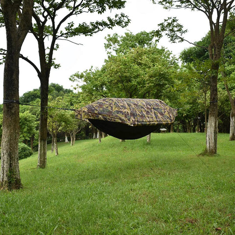 All In One Camping Hammock Tent With Mosquito Net And Rain Fly 3 In 1 Outdoor Hammock For Camping Or Backyard in wooded setting