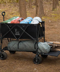 Double Decker Wagon With 600Lb Total Capacity And 400L Collapsible Utility Cart loaded with camping gear in forest