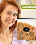Smiling woman holding a Four Pack Cereal Storage Container With Airtight Lid and Pour Spout, 4L, BPA Free, with pasta inside