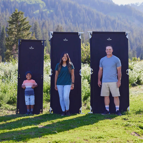 Heavy Duty XXL Camping Cot For Adults With Pivot Arm Easy Setup shown in three sizes outdoors