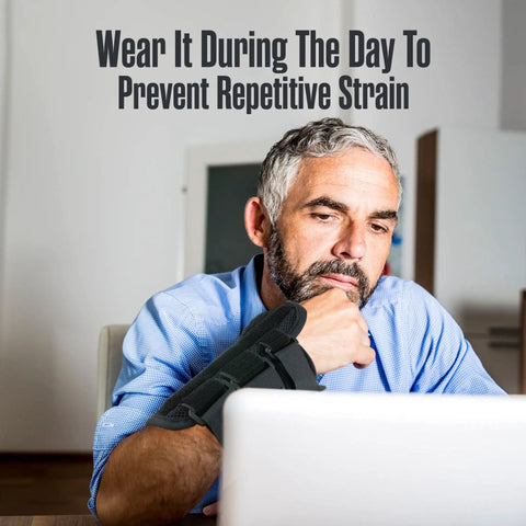 Man wearing Carpal Tunnel Wrist Brace 2 Pack For Pain Relief And Night Splint Comfort, sitting at desk