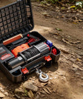 Portable Workhorse Winch 6000 Lbs 12V DC Electric With Synthetic Rope Wireless And Wired Remotes Box Style Recovery Kit With Fairlead Clevis Hook And Strap For ATV UTV Off Road Pulling Tasks, open kit on dirt