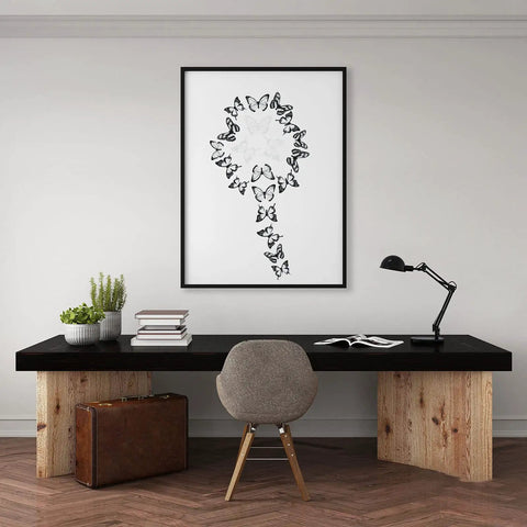 Framed artwork of black and white butterflies above a desk with 72 Piece Butterfly Wall Decor Sticker Set Removable 3D Mural Butterflies.