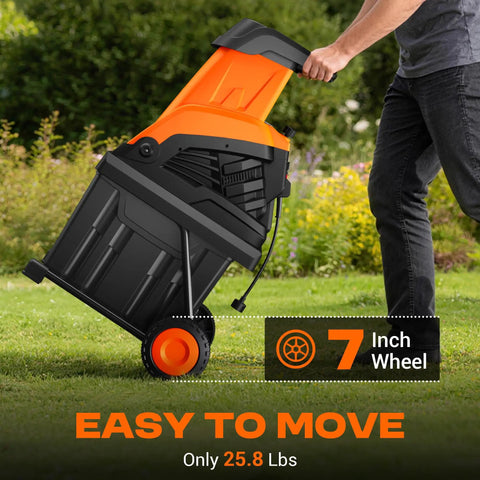 Person moving Powerful Electric Wood Chipper Shredder For Quick Yard Cleanup With 1800W Power on wheels in garden