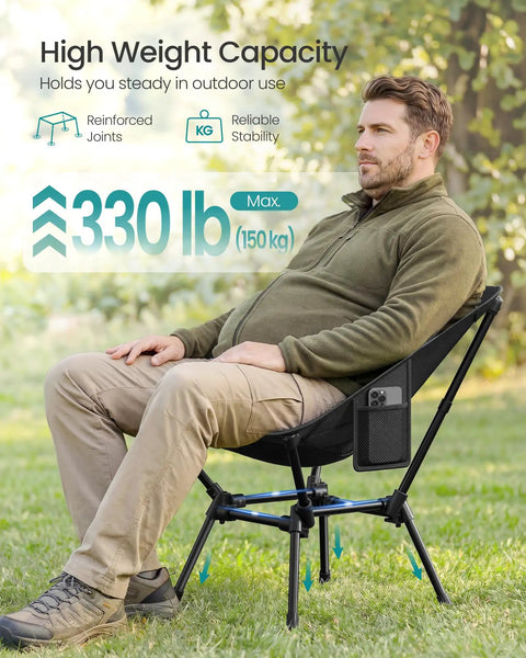 Person sitting on Portable Camping Chair With 330 Pounds Capacity Lightweight Backpacking Chair Adjustable Height Steel Frame Two Storage Pockets Solid Outdoor Hangout Seat For Travel Black on grass
