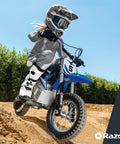 Child riding Blue Kids Electric Dirt Bike For Ages 8 And Up With 24V Battery, Speeds Up To 14 MPH, on dirt trail