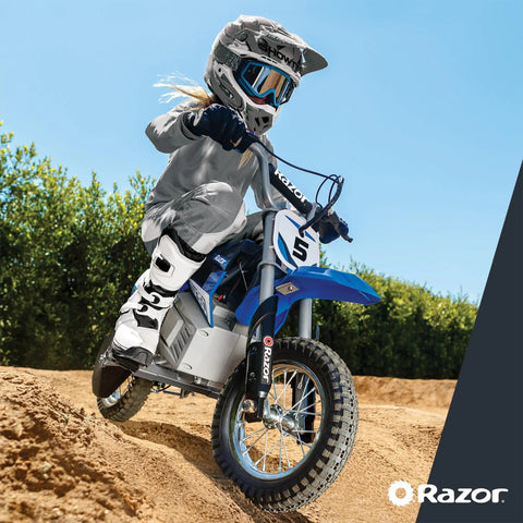 Child riding Blue Kids Electric Dirt Bike For Ages 8 And Up With 24V Battery, Speeds Up To 14 MPH, on dirt trail