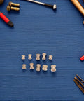 Huge 500 Pc Brass Knurled Insert Nut Assortment Kit With M2 M2.5 M3 Sizes For 3D Printing And DIY Plastic Builds Providing Rock Solid Vibration Proof Heat Resistant Fasteners Perfect For Pro Level Projects That Need Heavy Duty Retention. Brass knurled insert nuts in M2, M2.5 and M3 sizes on a blue background