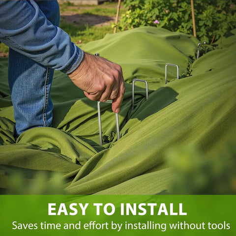 Person installing Heavy Duty 12 Inch Landscape Staples U Shaped Ground Stakes Galvanized 8 Gauge Steel for Outdoor Decor