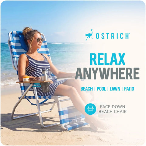 Woman relaxing on a 3N1 Lightweight Beach Reclining Lounge Chair with Footrest, blue stripe, at the beach with open face cavity.