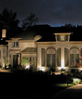 Sun Powered 4 LED Solar Spotlight Kit illuminating house facade at night, 2 Pack, 2 In 1 Adjustable Wall And Landscape Lights shown