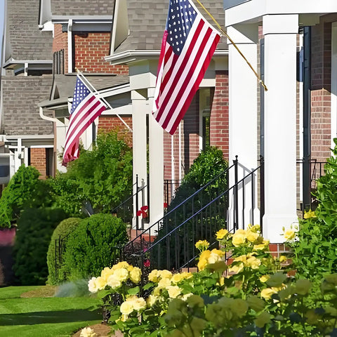 Front porch with 2.5 By 4 Ft American Flag Pole Sleeve For Outdoor Use, Built To Last Nylon Construction, displaying in front of houses.