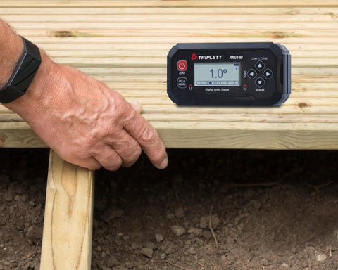 Precision Digital Level And Angle Gauge Finder With Bullseye Display Zero Offset Setup Dual Axis Calibration Audible Alert Magnetic Mount For Workshops in use on wooden planks.
