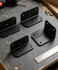 Beefy Heavy Duty Galvanized Corner Braces 90 Degree L Shaped Brackets With Pre Drilled Holes shown on a workbench with tools
