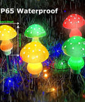 Dope Multicolor Solar Powered Mushroom Garden Lights with 50 LEDs, showcasing waterproof mushroom lights glowing in rain at night
