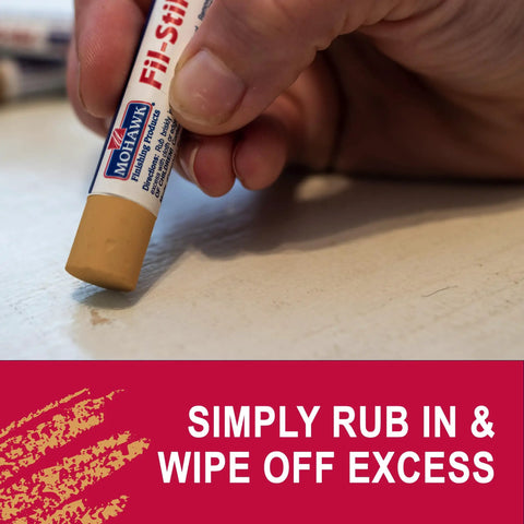 Light Golden Oak Wood Repair Wax Putty Stick For Scratches And Gouges applied to a surface for easy scratch repair, smooth finish.