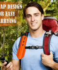 Hiker with backpack featuring 3 In 1 Ultralight Backpacking Trowel Shovel And Potty Tool in orange aluminum for easy carrying