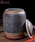 Top Shelf Ceramic Rice Storage Jar With Wooden Base Stand showing carved floral design and lid in a sleek kitchen setting.
