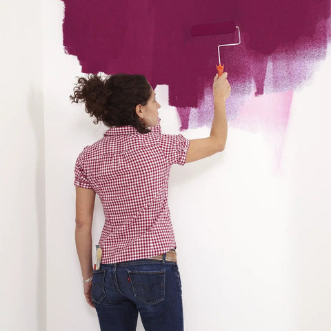 Woman painting over Paintable Removable Peel And Stick Wallpaper For Walls Create Your Own Designs Easy No Mess Self Adhering
