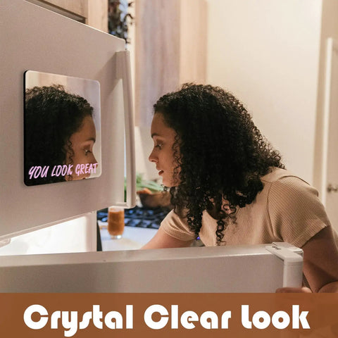 Woman using You Look Great Magnetic Locker Mirror 6 By 7 Inch on fridge, frameless with rounded corners, strong magnets, polished edge.