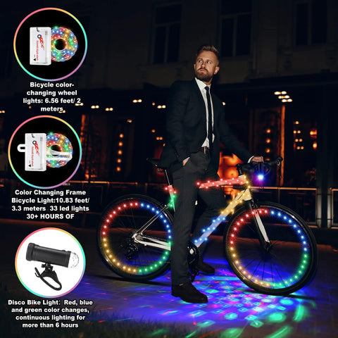 Person posing with bike equipped with Disco Bike LED Light Kit 4 Pack With 2 Wheel Lights, 1 Frame Light, 1 Headlight at night