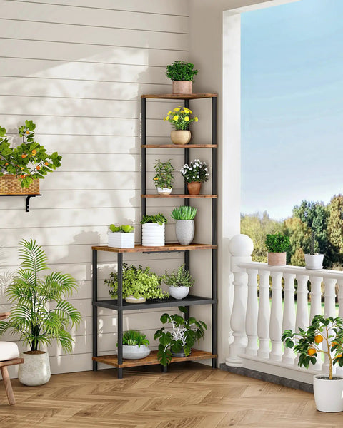 Heavy Duty Six Tier Industrial Corner Shelf With Swap Out Wood And Steel Mesh Boards Plus Work Surface Kicks Up Storage In Tight Quarters Perfect For Clean Setups In Apartments Or Home Offices Rustic Tone with plants