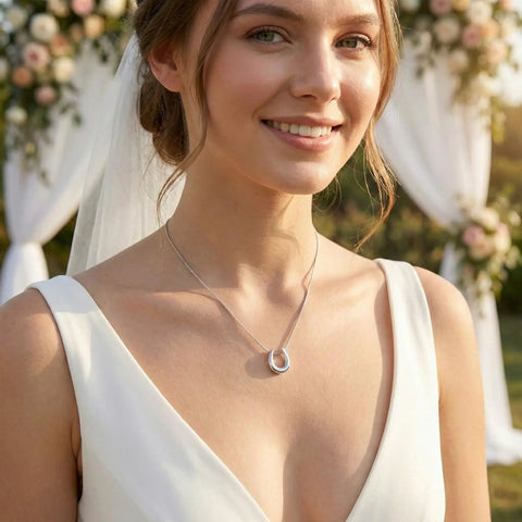 Bride wearing the Lucky Horseshoe Necklace For Women With U Shape Pendant In Silver Tone Stainless Steel Hypoallergenic Adjustable Chain