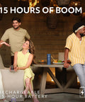 Group relaxing outdoors with Boom 4 Portable Waterproof Bluetooth Speaker With 360 Degree Sound and Bass on table