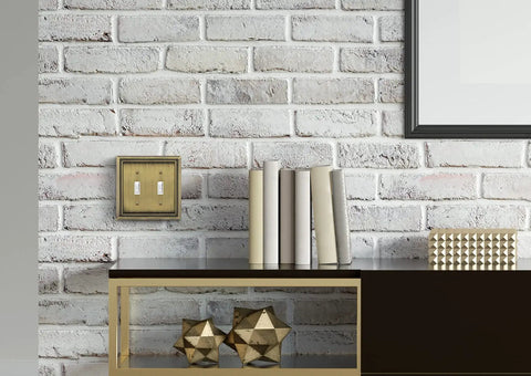 Sunken Pearls Beaded Wall Plate Cover on brick wall, heavy duty double toggle, antique brass finish, zinc alloy, hand polished
