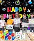Children holding drawings with science-themed party favors set, including 12 stamps and 24 temporary tattoos, against a birthday backdrop.