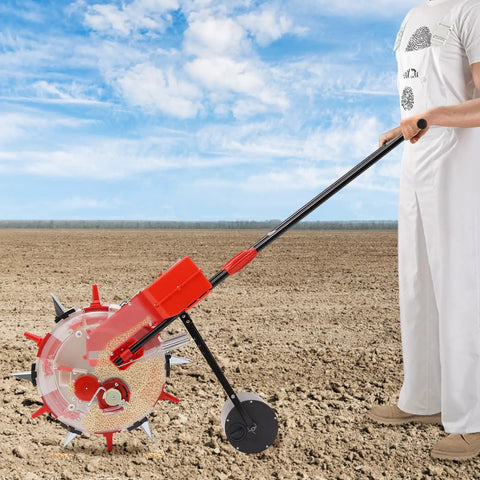 Person using Hand Push Seeder With Six Nozzles For Precise Garden Planting Walk Behind Seed Planter Iron And Plastic Construction
