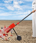 Person using Six Nozzle Hand Push Seeder For Precise Planting, Drops 1-2 Seeds Per Pull, 10.24 Inch Spacing, Red