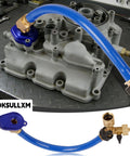 6.0L Oil Cooler Flush Kit With T Port And Anodized Aluminum Adapter for Ford 2003 to 2010 Diesel Engines on workbench