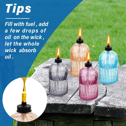 Glass Tabletop Torch Set Four Pack For Outdoor Use With 13.5 Oz Citronella Fuel on wooden table outdoors