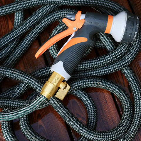 Expandable Telescopic Garden Hose End Adapter With Shut Off Valve And Repair Kit Fits Three Quarter Inch GHT on wood surface