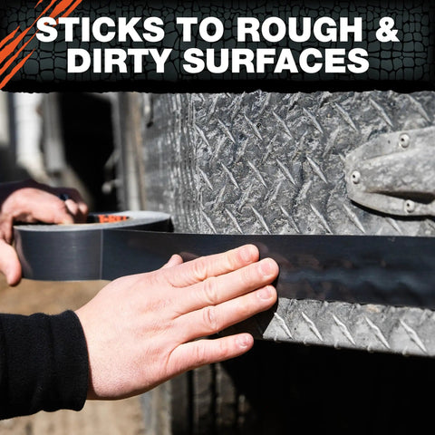 Applying Beast-Mode Duct Tape With Forge-Link Technology to rough, dirty metal surface for heavy-duty repair.