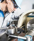 Operator using Heavy Duty 21 Piece Indexable Lathe Tool Set With Five Eighth Inch Shank Including Seven Metal Lathe Tool Holders And Fourteen Carbide Inserts For Turning Boring Grooving Threading And Cutting A Durable Precision Machining Kit