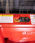 Heavy Duty Fully Electric Adjustable Straddle Stacker control panel with buttons and charging port, showcasing solid design.