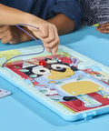 Legit Awesome Bluey Pediatrician Board Game For Kids Featuring Electronic Talking Sound Effects And All In One Carry Case With Two Play Modes And Super Chill Family Fun For Ages 6 Plus Totally Rad Interactive Playtime with hands playing on game board.