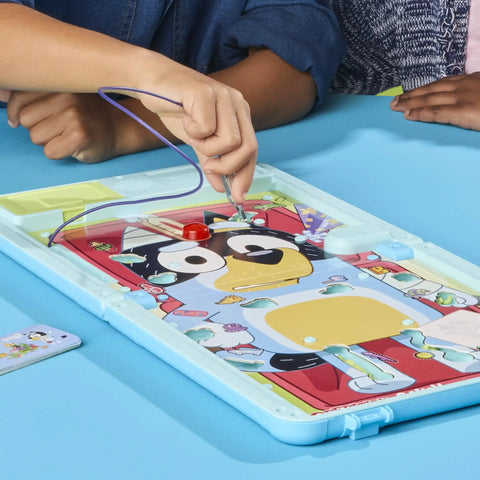 Legit Awesome Bluey Pediatrician Board Game For Kids Featuring Electronic Talking Sound Effects And All In One Carry Case With Two Play Modes And Super Chill Family Fun For Ages 6 Plus Totally Rad Interactive Playtime with hands playing on game board.