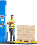 Heavy Duty Semi Auto Pallet Wrapper With Built In Digital Scale No Sweat Wrapping For 5000 Lb Loads next to stacked goods.