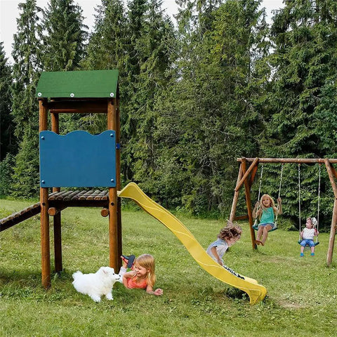 Children playing on a wooden swing set with slide, featuring a 43 By 90 Inch Swing Set Canopy Replacement, in a grassy area with trees.