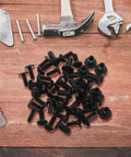 20 Pack Black Iron Furniture Screws With Nuts For Chairs And Cabinets, Socket Drive Bolts scattered on wooden surface