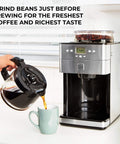 Grind And Brew Coffee Maker With Burr Grinder For Consistent Flavor, stainless steel, pouring coffee into a mug.